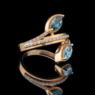 By-Pass Design 14K Blue Topaz and Diamond Ring